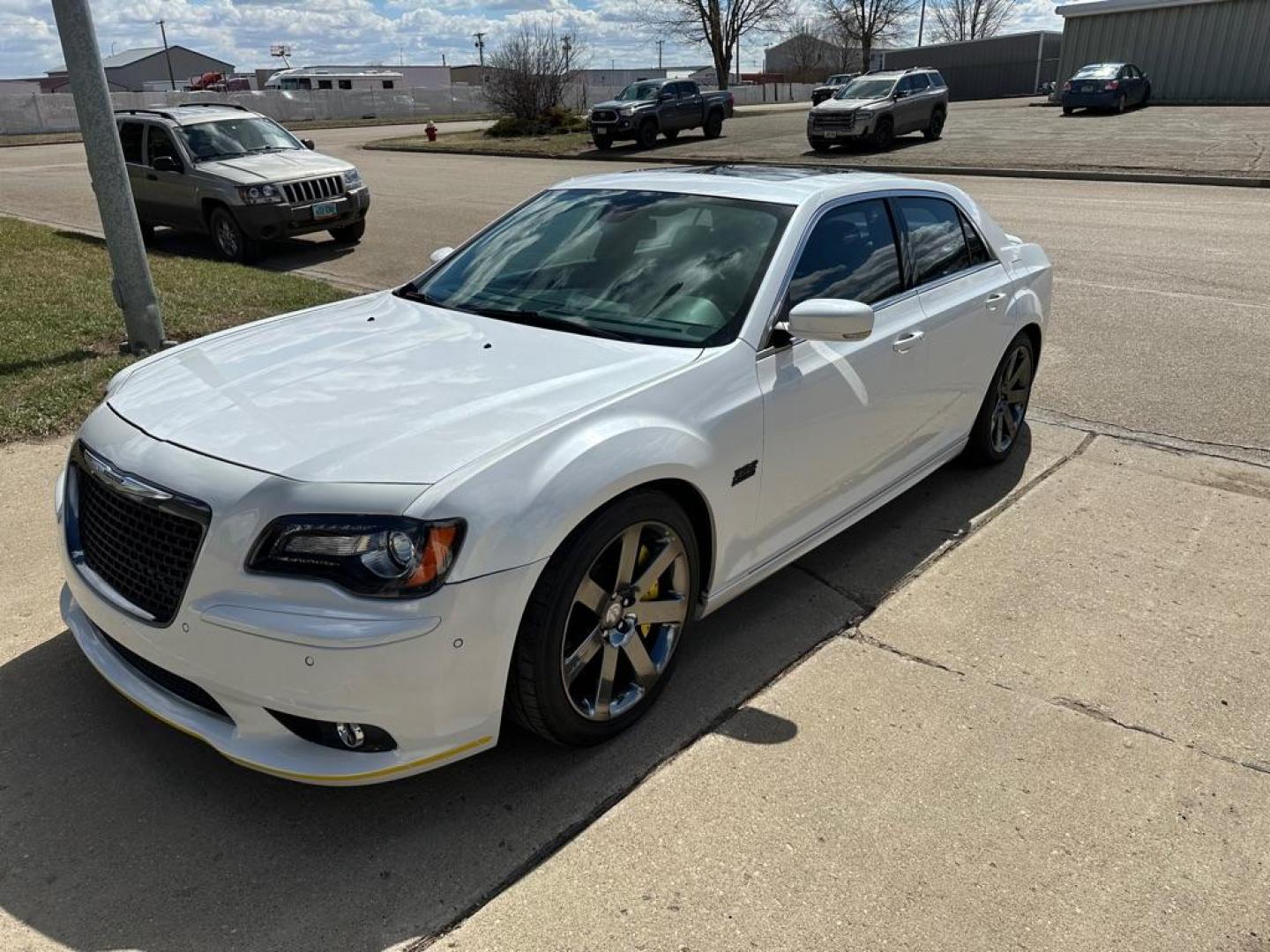 2012 WHITE CHRYSLER 300 SRT-8 (2C3CCAFJ5CH) with an 6.4L engine, Automatic transmission, located at 1030 S. 22nd St., Bismarck, ND, 58504, (701) 258-0022, 46.793560, -100.758118 - 6.4 Liter SRT-8 YELLOW BRAKE CALIBER COVERS-AUTO - Photo#0