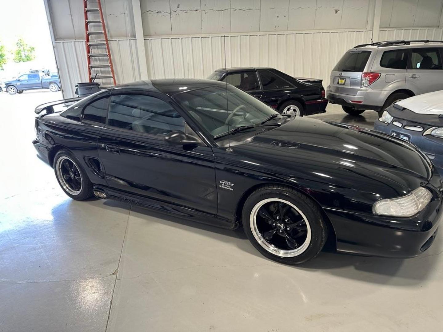 1996 BLACK FORD MUSTANG GT (1FALP42X5TF) with an 4.6L engine, Automatic transmission, located at 1030 S. 22nd St., Bismarck, ND, 58504, (701) 258-0022, 46.793560, -100.758118 - 4.6 LITER, AUTO, BLACK BULLET WHEELS, BLORA SIDE EXHAUSR, 35OOO ACTUAL MILES, LIKE NEW - Photo#1