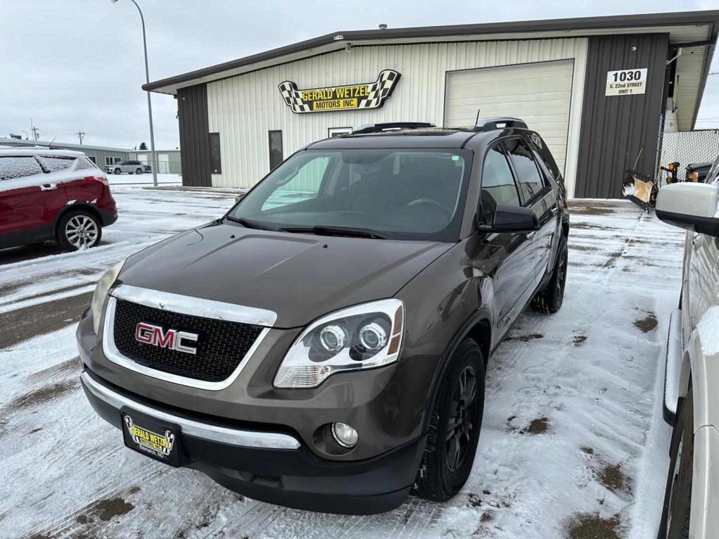 2007 BROWN GMC ACADIA SLE (1GKEV13787J) with an 3.6L engine, Automatic transmission, located at 1030 S. 22nd St., Bismarck, ND, 58504, (701) 258-0022, 46.793560, -100.758118 - light left quarter damage - Photo#0