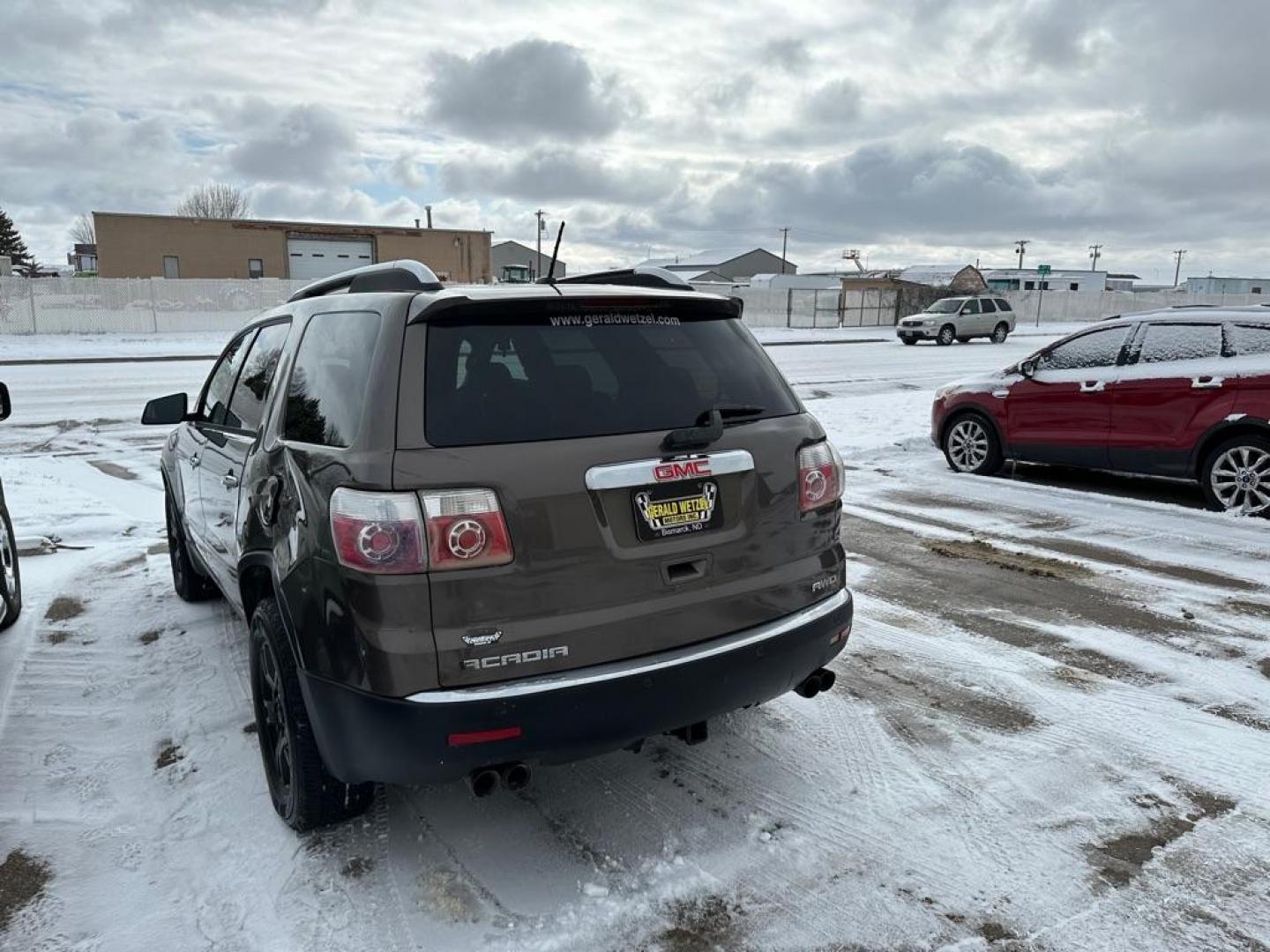 2007 BROWN GMC ACADIA SLE (1GKEV13787J) with an 3.6L engine, Automatic transmission, located at 1030 S. 22nd St., Bismarck, ND, 58504, (701) 258-0022, 46.793560, -100.758118 - light left quarter damage - Photo#2