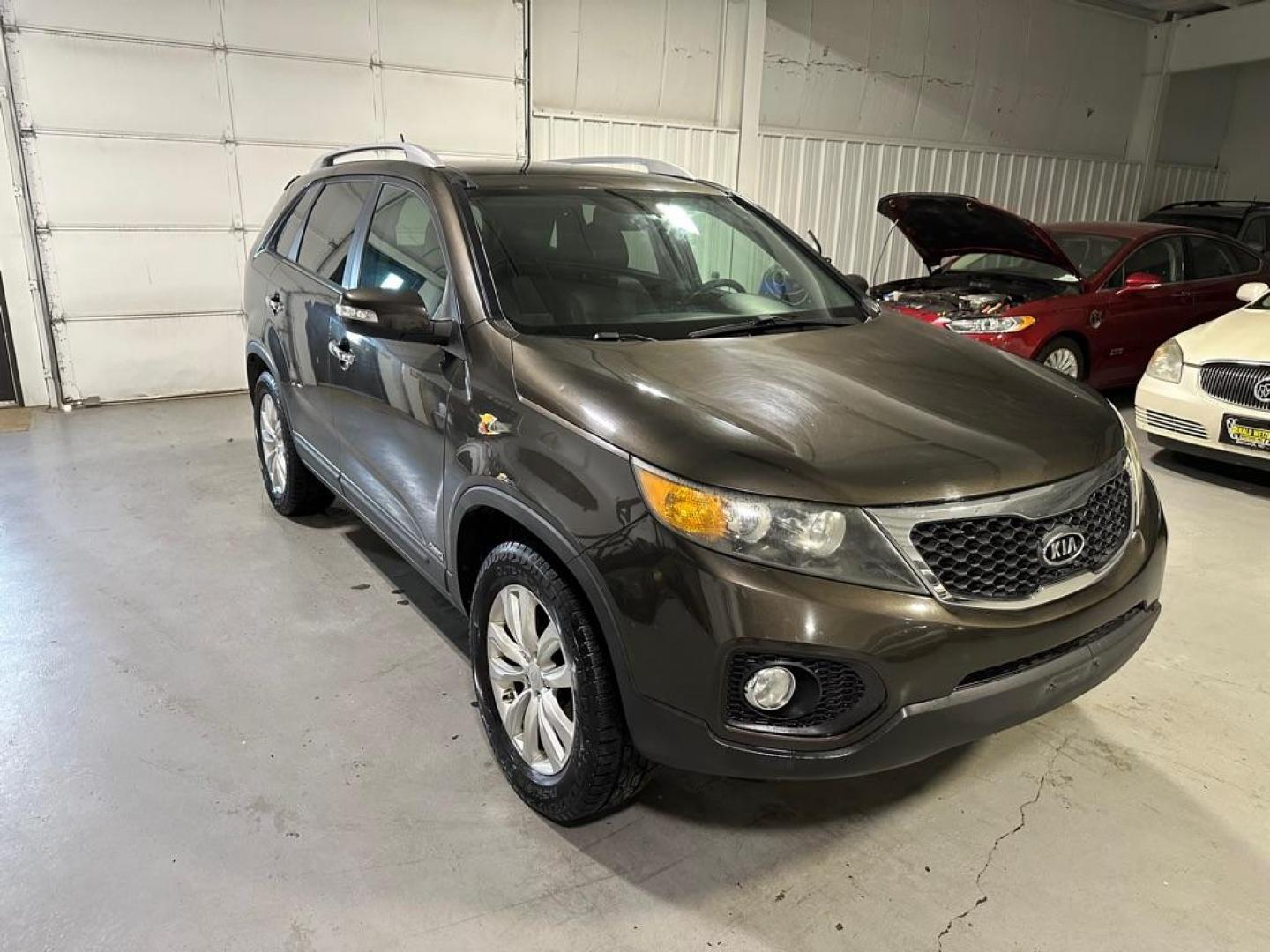 2011 BLACK KIA SORENTO EX (5XYKUDA29BG) with an 3.5L engine, Automatic transmission, located at 1030 S. 22nd St., Bismarck, ND, 58504, (701) 258-0022, 46.793560, -100.758118 - Nice CLean Unit AWD - Photo#1