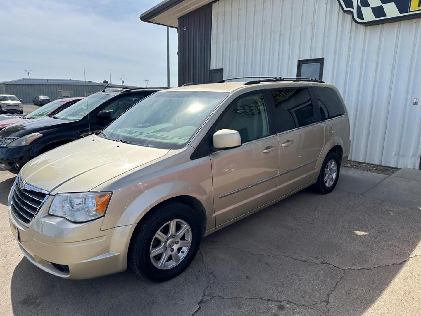 2010 GOLD CHRYSLER TOWN and COUNTRY TOURING (2A4RR5DX2AR) with an 4.0L engine, Automatic transmission, located at 1030 S. 22nd St., Bismarck, ND, 58504, (701) 258-0022, 46.793560, -100.758118 - PRIOR DAMGE STAMPED ON TITLE - Photo#1