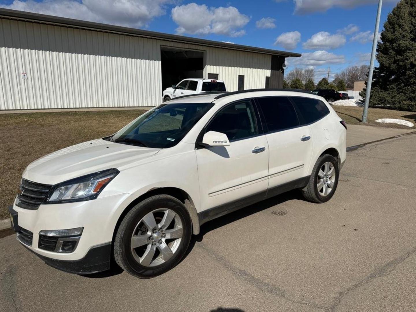 2015 WHITE CHEVROLET TRAVERSE LTZ (1GNKVJKD4FJ) with an 3.6L engine, Automatic transmission, located at 1030 S. 22nd St., Bismarck, ND, 58504, (701) 258-0022, 46.793560, -100.758118 - Photo#0