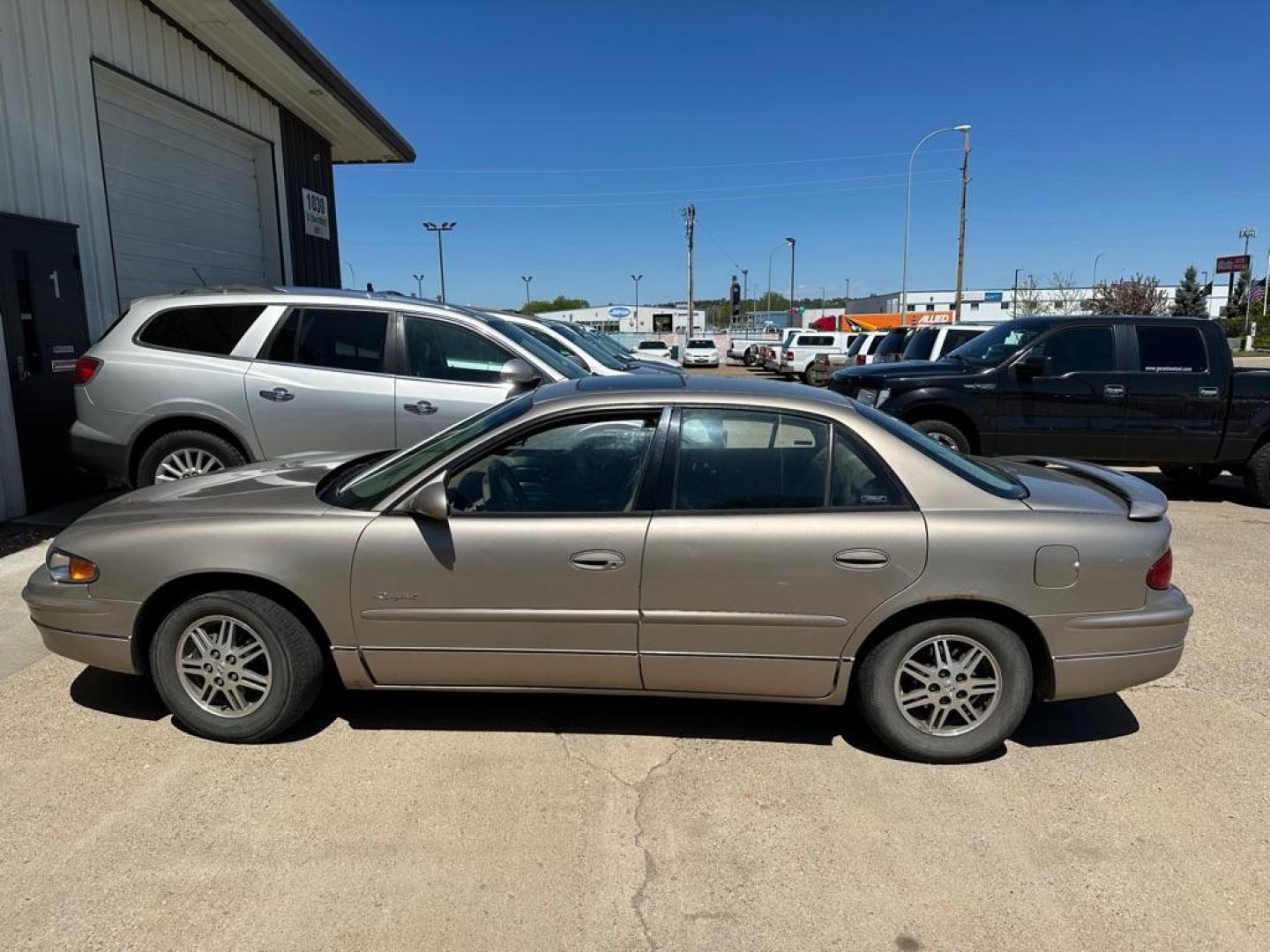 2001 GOLD BUICK REGAL LS (2G4WB55K011) with an 3.8L engine, Automatic transmission, located at 1030 S. 22nd St., Bismarck, ND, 58504, (701) 258-0022, 46.793560, -100.758118 - 3.8 liter. great mileage car - Photo#0