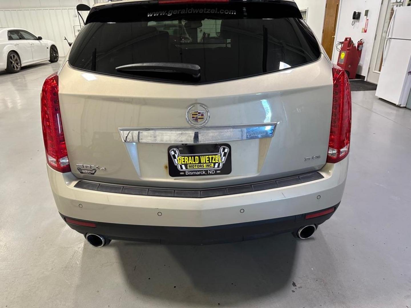 2012 TAN CADILLAC SRX PREMIUM COLLECTION (3GYFNFE36CS) with an 3.6L engine, Automatic transmission, located at 1030 S. 22nd St., Bismarck, ND, 58504, (701) 258-0022, 46.793560, -100.758118 - Photo#2