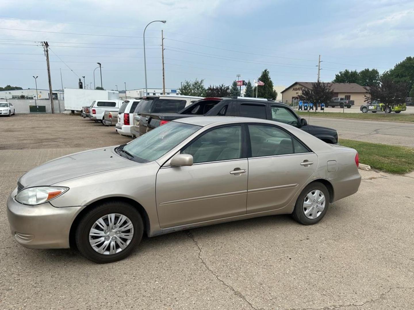 2002 BROWN TOYOTA CAMRY LE (4T1BE32K62U) with an 2.4L engine, Automatic transmission, located at 1030 S. 22nd St., Bismarck, ND, 58504, (701) 258-0022, 46.793560, -100.758118 - AC BLOWS COLD - Photo#0