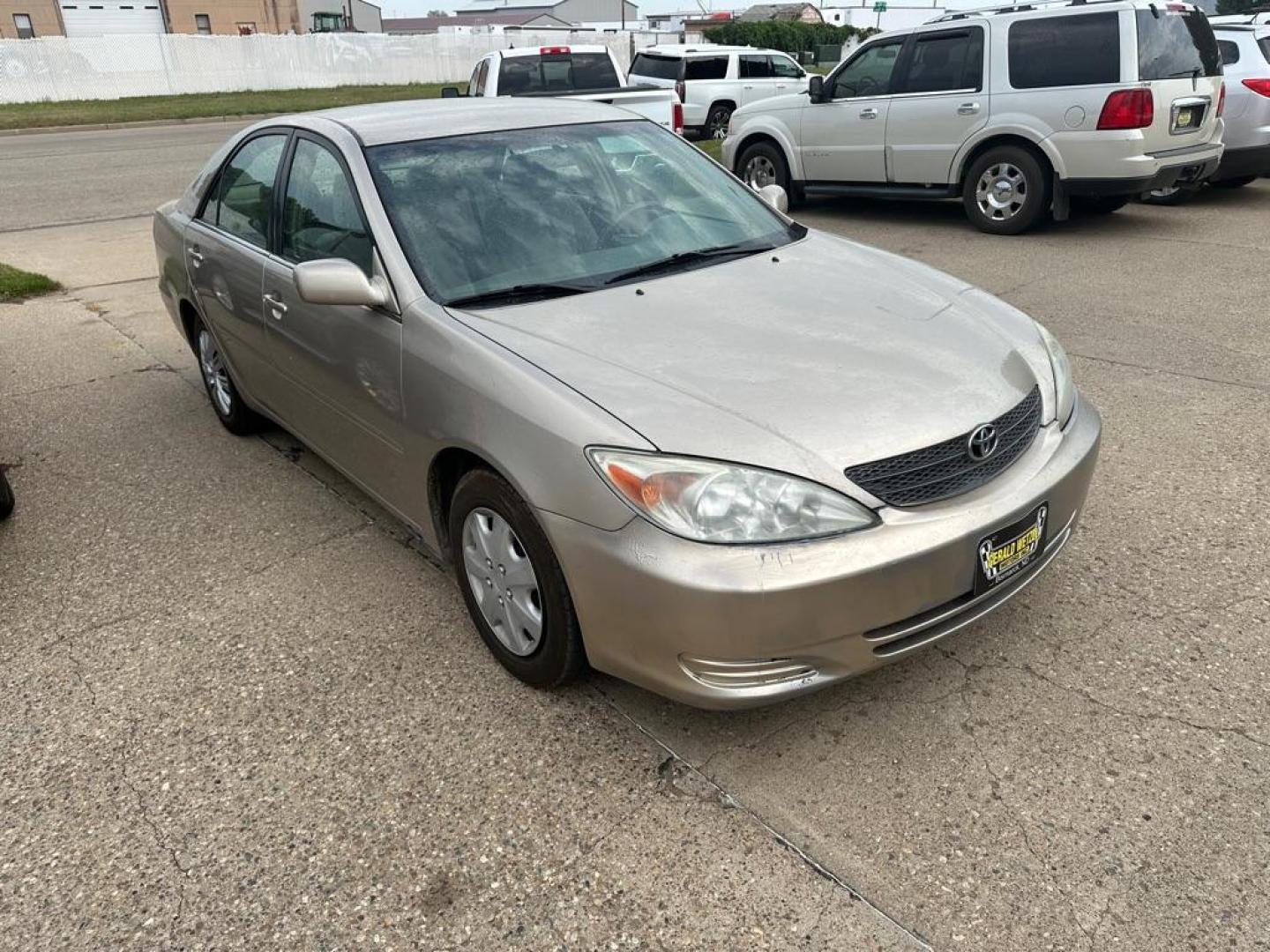 2002 BROWN TOYOTA CAMRY LE (4T1BE32K62U) with an 2.4L engine, Automatic transmission, located at 1030 S. 22nd St., Bismarck, ND, 58504, (701) 258-0022, 46.793560, -100.758118 - AC BLOWS COLD - Photo#1