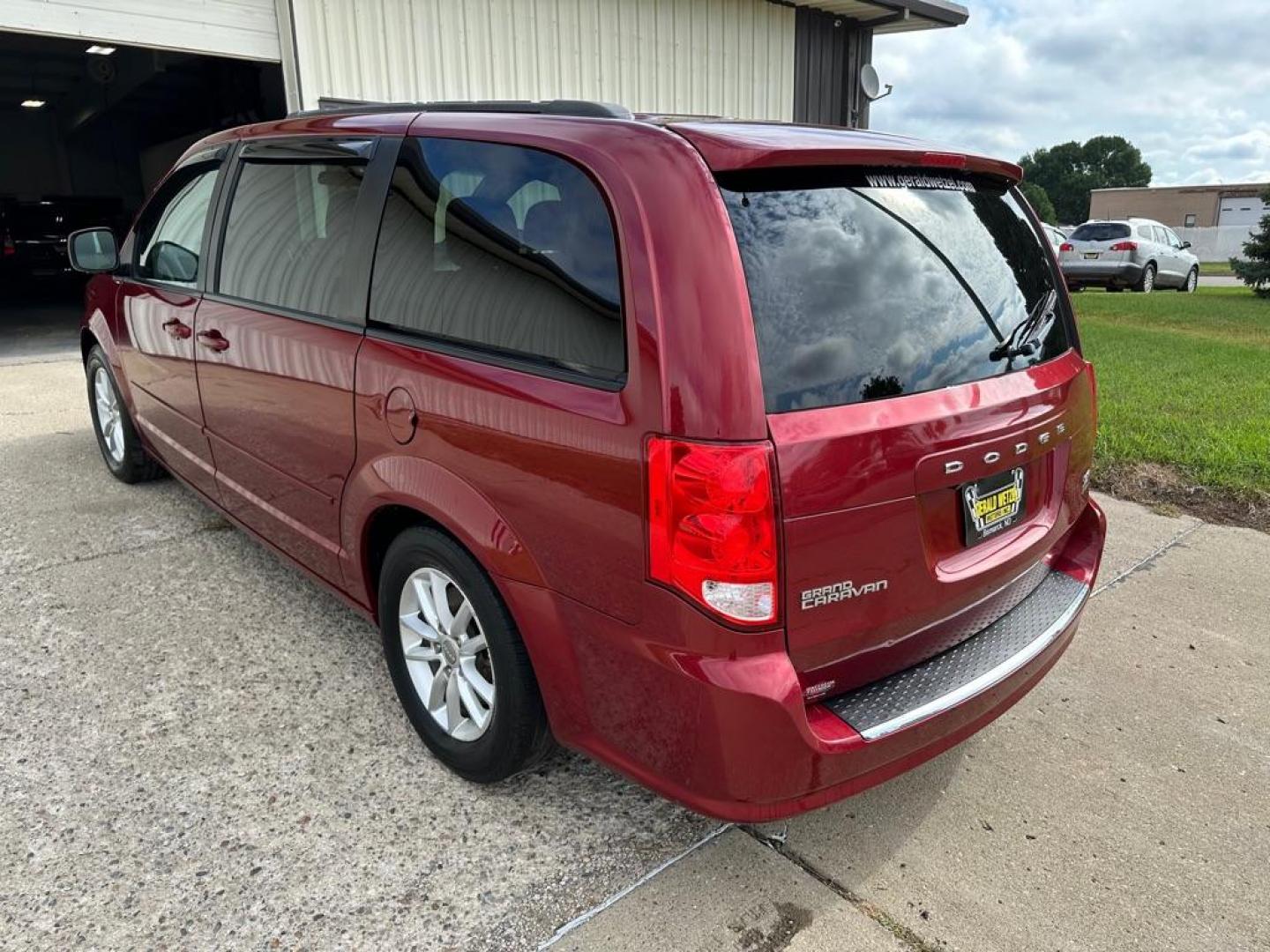 2016 RED DODGE GRAND CARAVAN SXT (2C4RDGCG5GR) with an 3.6L engine, Automatic transmission, located at 1030 S. 22nd St., Bismarck, ND, 58504, (701) 258-0022, 46.793560, -100.758118 - Photo#1