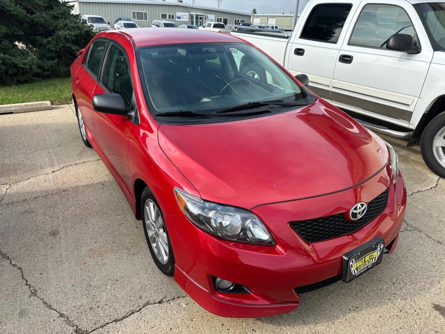 2009 RED TOYOTA COROLLA BASE (1NXBU40E09Z) with an 1.8L engine, Automatic transmission, located at 1030 S. 22nd St., Bismarck, ND, 58504, (701) 258-0022, 46.793560, -100.758118 - Photo#2