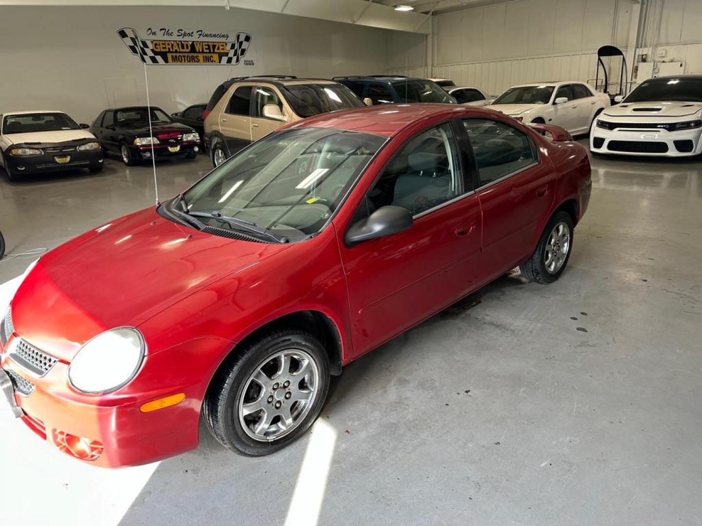 2005 RED DODGE NEON SXT (1B3ES56C15D) with an 2.0L engine, Automatic transmission, located at 1030 S. 22nd St., Bismarck, ND, 58504, (701) 258-0022, 46.793560, -100.758118 - Photo#0