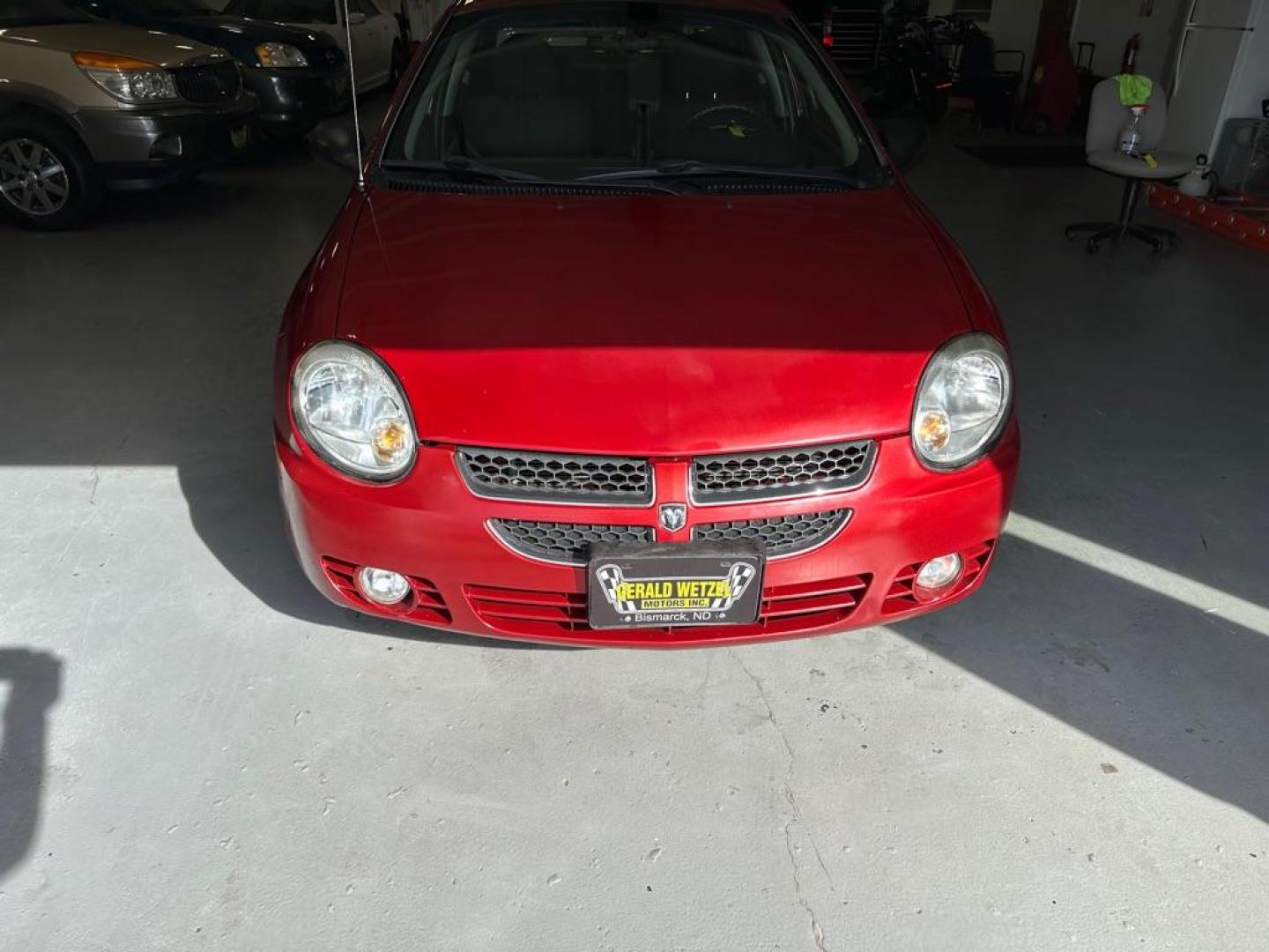 2005 RED DODGE NEON SXT (1B3ES56C15D) with an 2.0L engine, Automatic transmission, located at 1030 S. 22nd St., Bismarck, ND, 58504, (701) 258-0022, 46.793560, -100.758118 - Photo#1