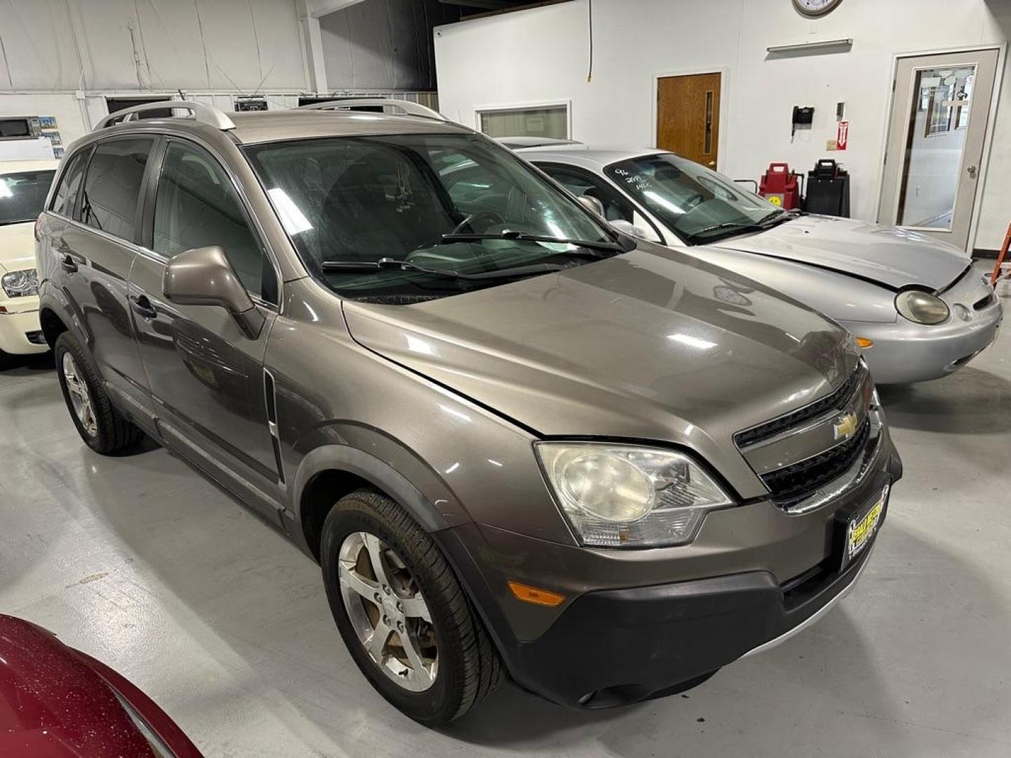 2012 BROWN CHEVROLET CAPTIVA SPORT (3GNAL2EK5CS) with an 2.4L engine, Automatic transmission, located at 1030 S. 22nd St., Bismarck, ND, 58504, (701) 258-0022, 46.793560, -100.758118 - 30 MPG - Photo#1