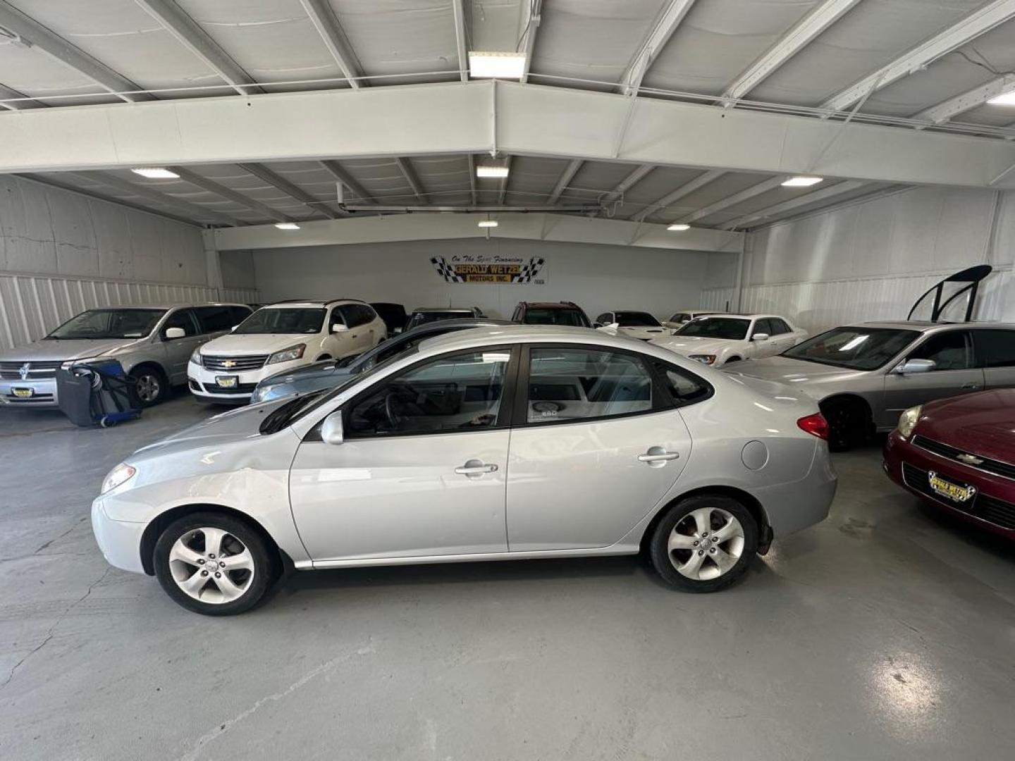 2009 SILVER HYUNDAI ELANTRA GLS (KMHDU46D39U) with an 2.0L engine, Automatic transmission, located at 1030 S. 22nd St., Bismarck, ND, 58504, (701) 258-0022, 46.793560, -100.758118 - Photo#0